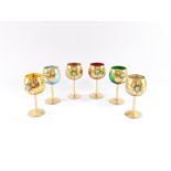 A set of six Continental gilt highlighted and painted goblets, each with circular bowls raised with