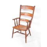 A late 19thC/early 20thC ash and elm ladder back grandfather chair, with curved horizontal splats, s