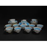 A Foley early 20thC porcelain tea service, decorated with comports of fruit and turquoise bands, pri