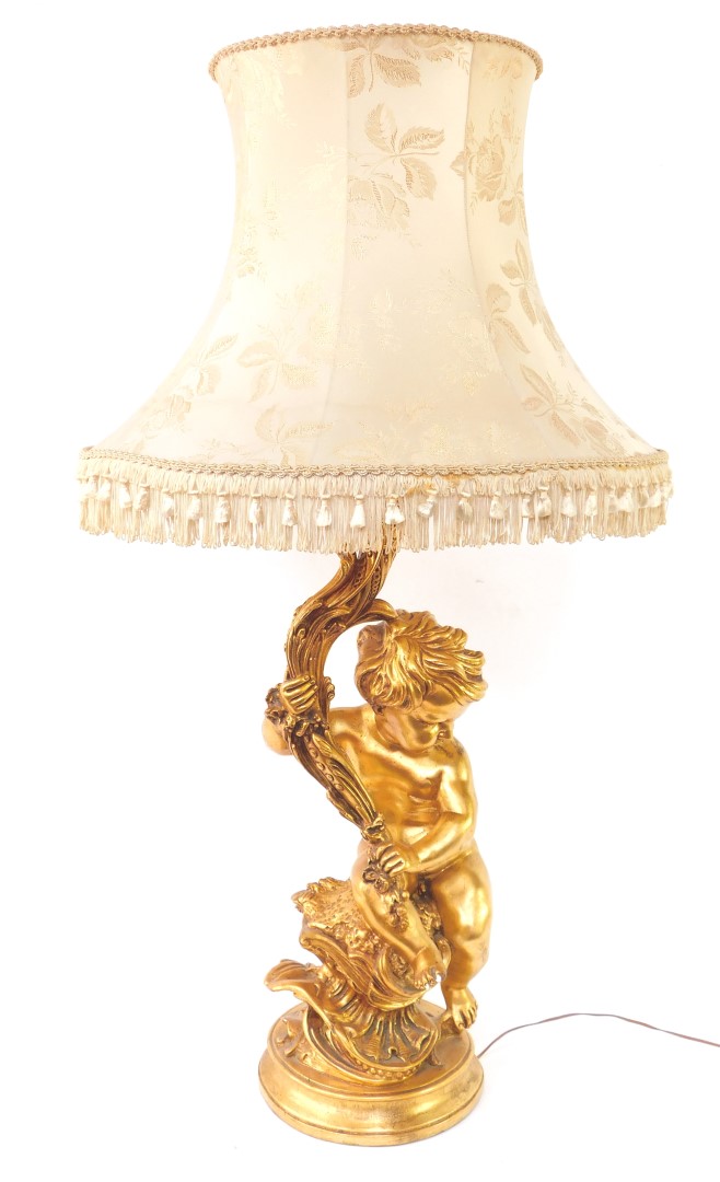 A 20thC plaster finish rococo table lamp, formed as a figure of a child, entwined stem, on a circula