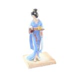 A Franklin Mint porcelain figure modelled as Tamiko, designed by Manabu Saito, boxed, 29cm high.