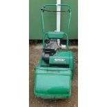 A Qualcast Classic petrol cylinder mower.