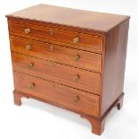 An Edwardian Sheraton revival mahogany chest, of four long drawers, each with brass knob handles and