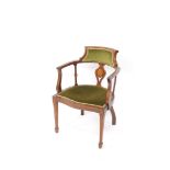 An Edwardian mahogany boxwood sprung Sheraton Revival armchair, with shaped overstuffed back, heart