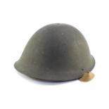 A WWII British Army helmet, dated 1945.
