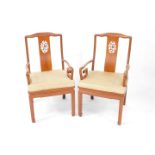 A pair of Chinese hardwood carver chairs, each with vertical pierced back splats, plain cylindrical