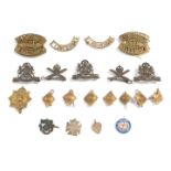 Military badges, to include The Manchester Regiment, officer's pips, Honour badge 1914, college badg