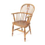 A 20thC ash and elm low back Windsor chair, with pierced fret work style splat, plain turned spindle