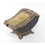 A late 19thC cast iron brass and metal coal box, of sleigh form, heavily cast and raised with scroll