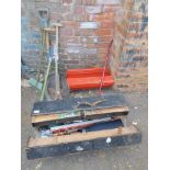 A red cantilever tool box and contents, a joiner's tool box, with saws, level, drill, jigsaw, etc.,