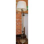 A chrome articulated standard lamp, with cream shade, 150cm high.