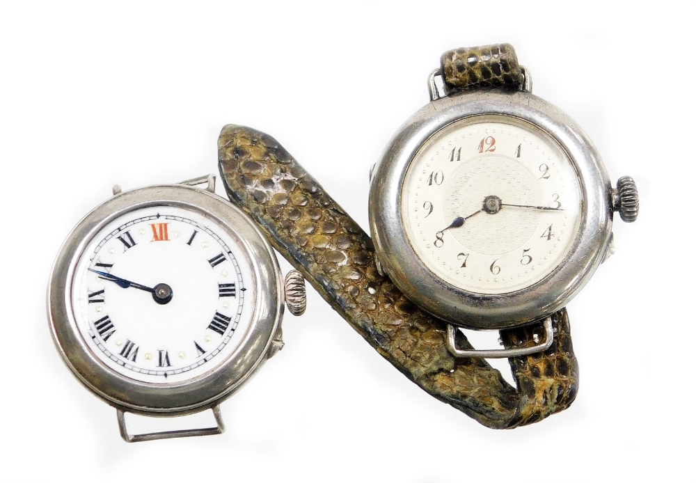 Two silver cased wristwatches, to include one with white enamel dial, gold marker points, with a Swi