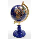 A miniature table top terrestrial globe, on a blue metal stand, 34cm high.