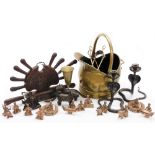 A group of brassware, to include a coal helmet, knife set, pair of nut crackers shaped as dogs, nude