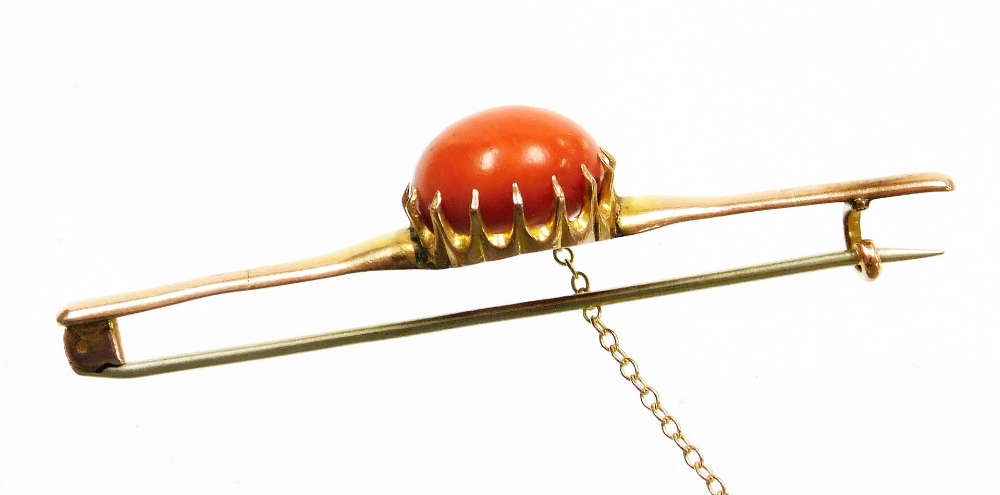 A 9ct gold coral set bar brooch, the large circular coral cabochon in a claw setting, 1.6mm wide, 9. - Image 2 of 3