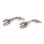 A pair of early 20thC novelty silver plated greyhound knife rests, of outstretched running form, 9cm