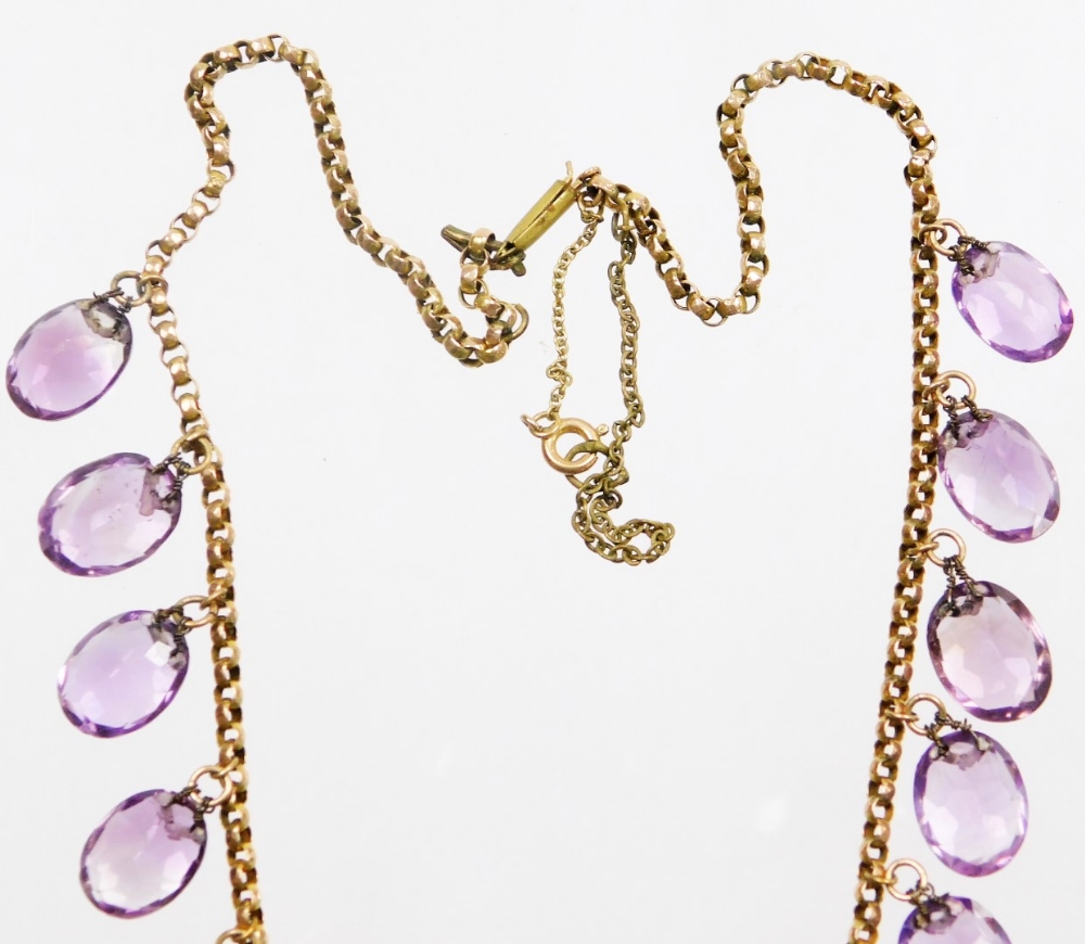 An Edwardian design amethyst graduated beaded necklace, set with twenty two oval cut amethysts, on a - Image 3 of 3