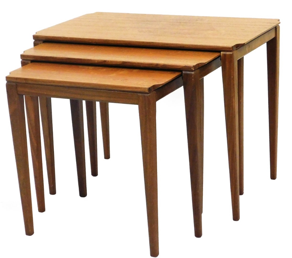 A nest of vintage teak tables circa 1960s, rectangular topped, on square tapering legs, the largest