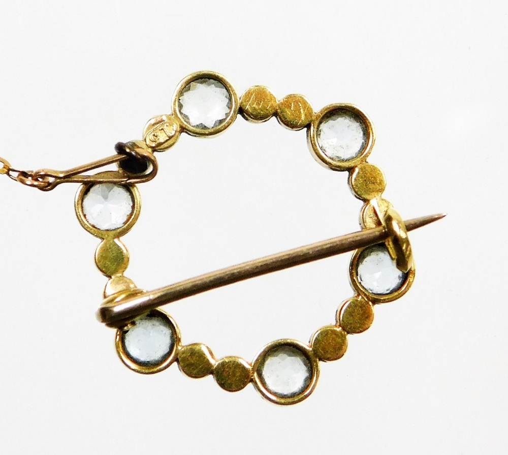 An Edwardian circular brooch, set with six aquamarines, and ten various seed pearls, in a yellow met - Image 2 of 2