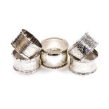 Five various silver napkin rings, to include a Victorian napkin ring of shaped circular form, heavil