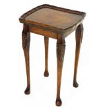 A mahogany finished occasional table, the shaped moulded rectangular top raised on quadruple legs pa