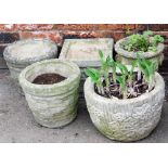 A group of reconstituted garden planters, to include a pair of circular planters, a square planter,