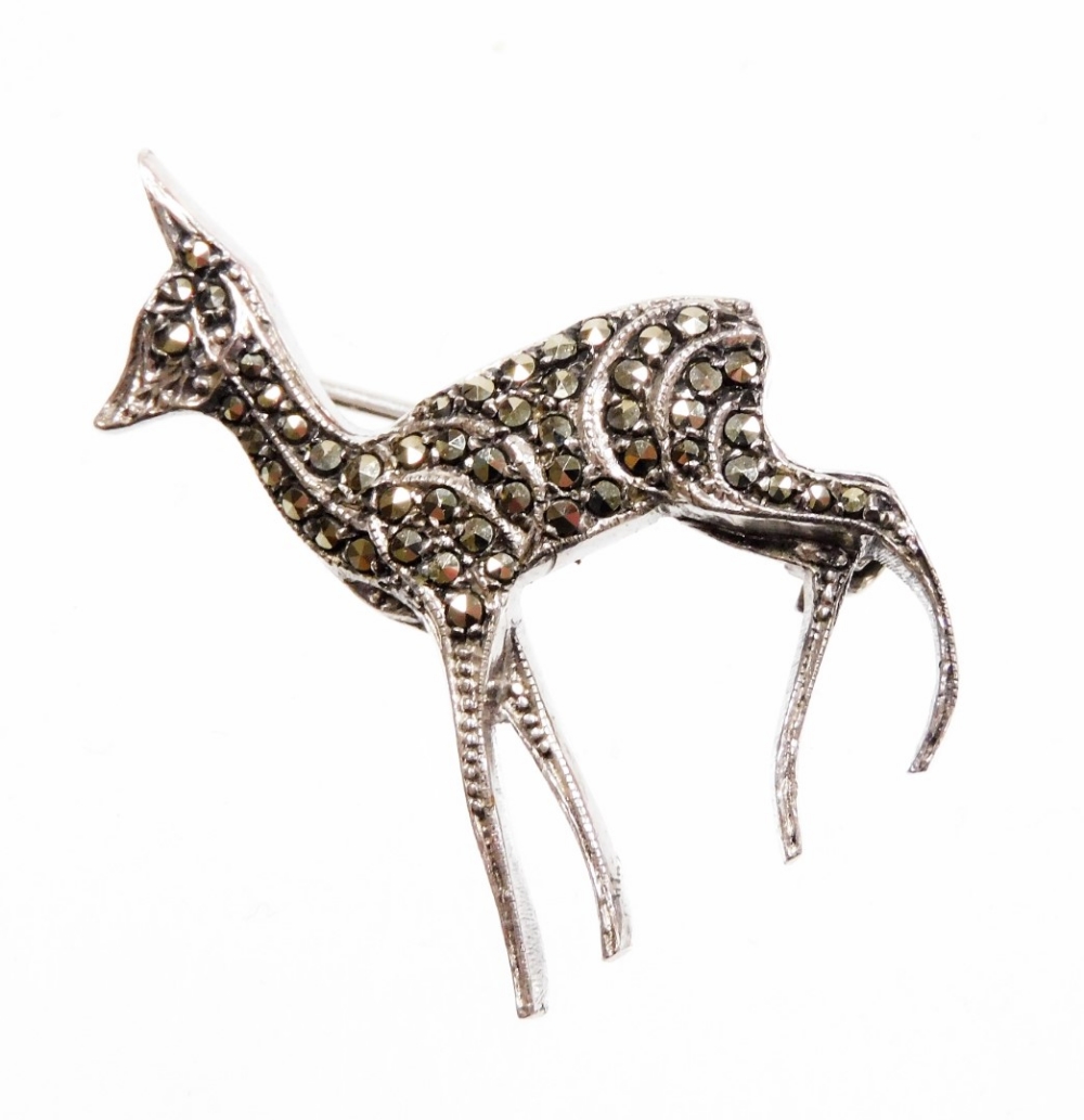 A marcasite deer brooch, set with various marcasite on a white metal back, with single pin, marked s