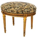 A 19thC oval giltwood stool, with overstuffed and sprung tapestry seat, and reeded taper legs, 50cm