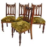 A set of four late Victorian Arts & Crafts mahogany stained dining chairs, each with shaped pierced