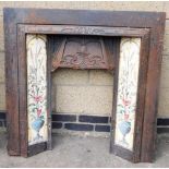 A Victorian style metal fireplace surround, inset with five floral tile panels (AF), 100cm high, 96c