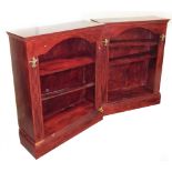 A pair of painted bookcases, each with a red lacquer type finish on hardwood, with reeded stems and