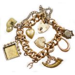 A 9ct gold charm bracelet, with various charms, on curb link bracelet, marked 9c to links, with a 9c