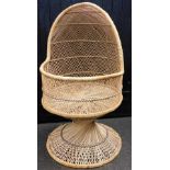 A 20thC beehive style wicker cot, enclosed with domed top on shaped stem and circular foot, 138cm hi