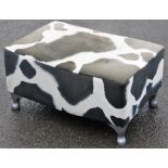 A cow print foot stool, upholstered in velvet cow print material, on silvered feet (AF), 31cm high,