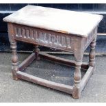 A late 18thC oak joint stool, with moulded top, scoop carved frieze, turned baluster legs and plain