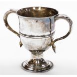 A Victorian silver trophy cup, with two shaped handles on a stepped base, London 1896, maker GS TH,