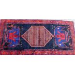 A deep ground rug, with large central medallion, on Greek key borders, with patch repair, 323cm x 15