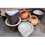 A group of garden planters, hanging baskets, etc., some pots with glazed decoration. (a quantity)
