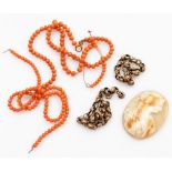 A small group of costume jewellery, to include a coral beaded necklace, a gold plated necklace and a