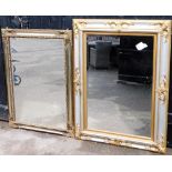 Two silvered wooden framed rectangular wall mirrors, with shell applied scroll corners, with silvere