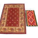 Two rugs, comprising a Kilim geometric bright cut rug, 88cm x 56cm and a modern machine woven elepha