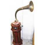 A HMV gramophone and stand, on a red hardwood stand with turned finials and octagonal base, 166cm hi