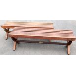 Two stained wooden benches, each on x stretchers, 150cm wide x 42cm deep.