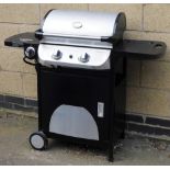 A gas and coal barbeque, with cover.