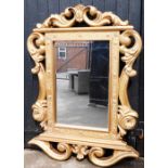 A modern Italian style gilt framed wall mirror, the border decorated with various words including It