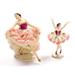 Two Dresden crinoline figures, each of ladies dancing, with flowing white and pink dresses, 18cm and