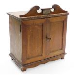 An Edwardian string inlaid mahogany smokers cabinet, with presentation plaque marked To Mr GJ Dawson