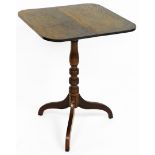 A late 19thC carved oak tripod table, the rectangular top with canted corners, on drop leaf top with