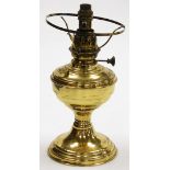 A Victorian brass oil lamp, converted to electricity, 34cm high.