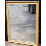 A modern rectangular wall mirror, with gilt pleated surround, 154cm high, 87cm wide.